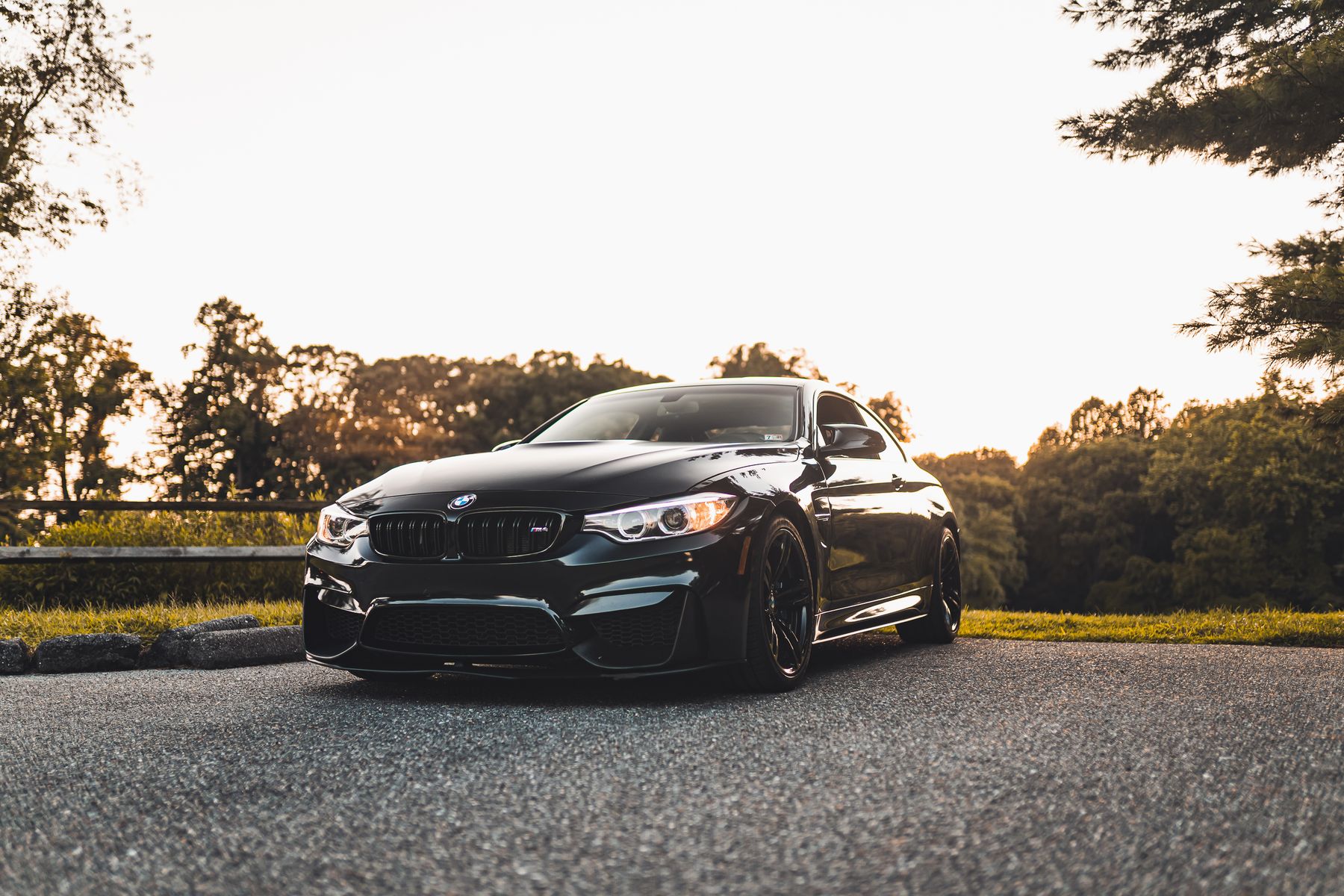 Polished black sports car parked outdoors